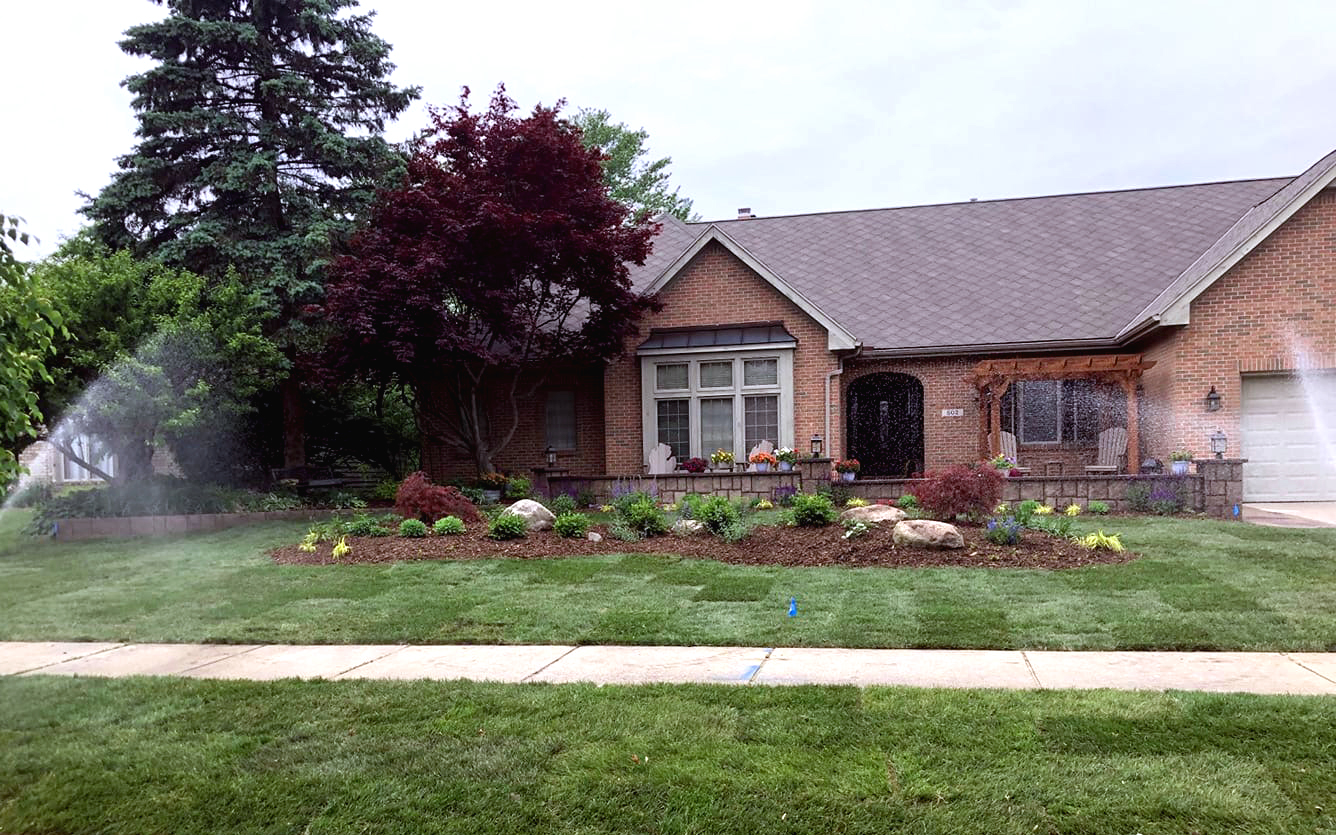 Residential landscaping front elevation with irrigation going